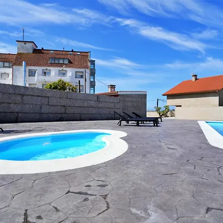 アパート Con Piscina Frente A La Playa De Paxarinas サンシェンショ